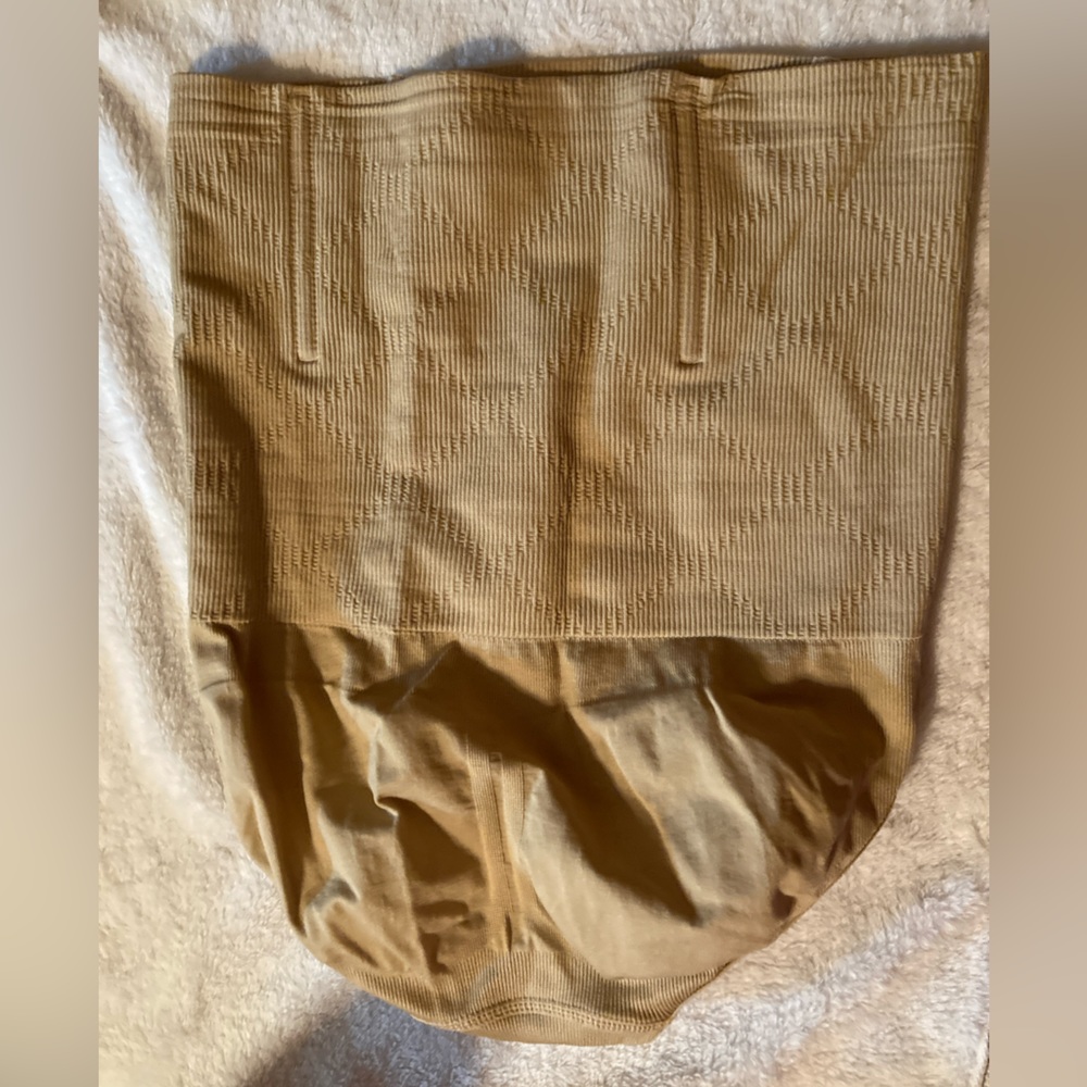 Says size Large but fits like a Medium Girdle Panties with wire shaping at top